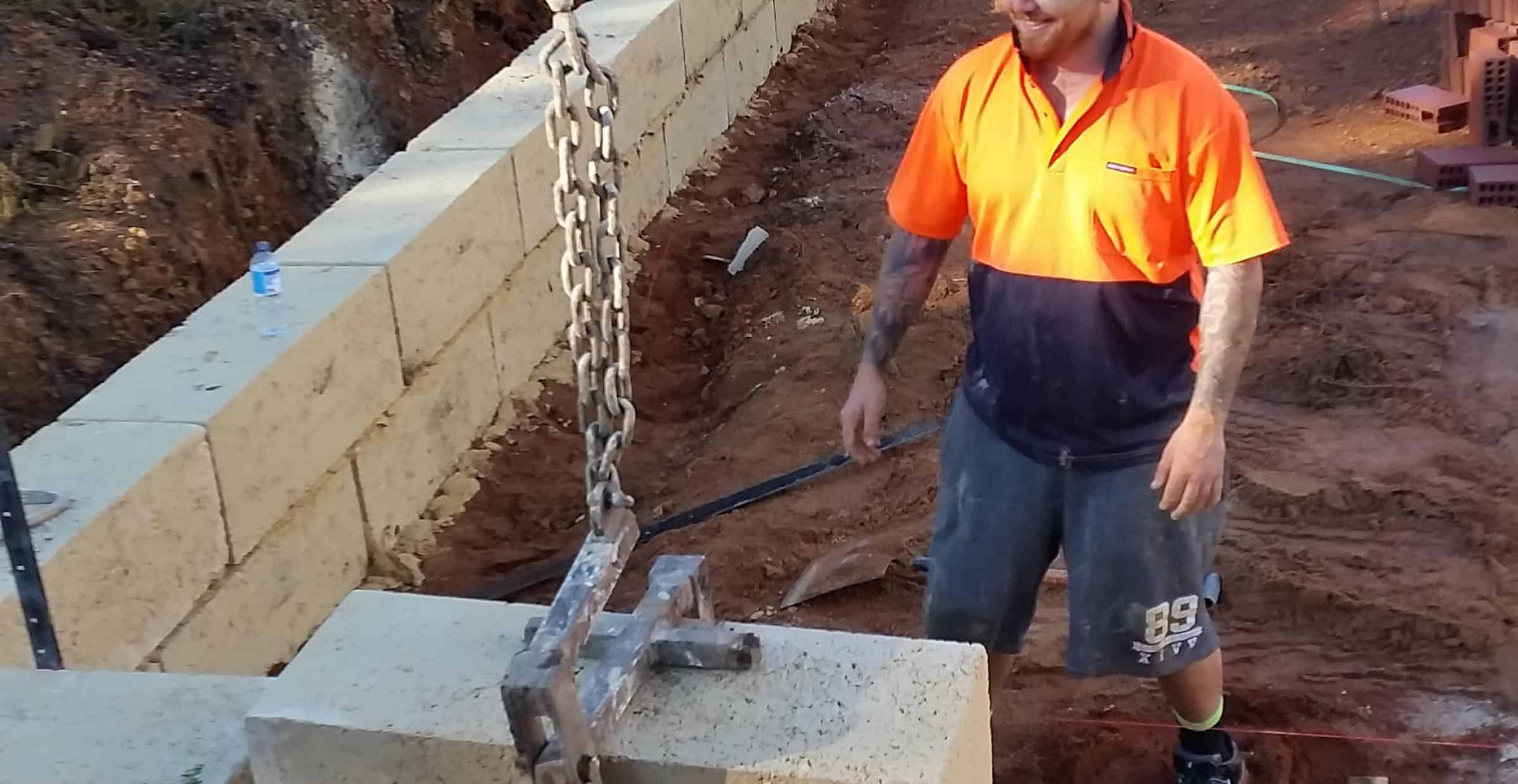 Friendly limestone wall builder at work | Limestone Walls Perth